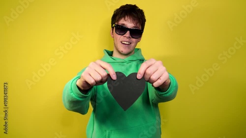 A happy man receives a gift and examines it