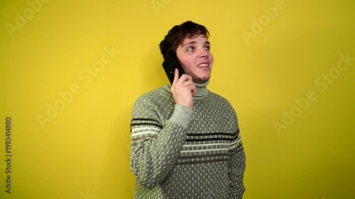 Phone call by cellphone. Attractive charismatic stylish guy has an unpleasant phone
