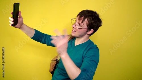 Phone call by cellphone. Attractive charismatic stylish guy has an unpleasant phone