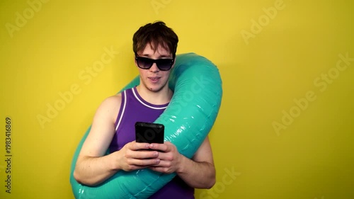 Phone call by cellphone. Attractive charismatic stylish guy has an unpleasant phone