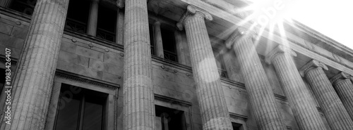 Columns on Old Building with Sunstar or Sunshine on  Architecture and Design Library Courthouse or Government Building