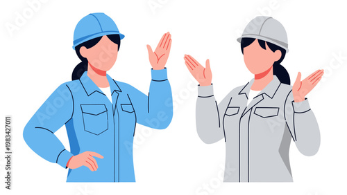 Construction workers : Two construction workers in hard hats gesture, illustrating teamwork and professional collaboration.