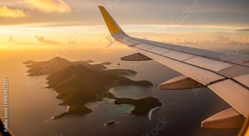 Airplane wing view of tropical islands at sunset with vibrant golden light
