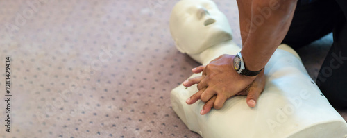 Tableau sur toile CPR training using and an AED and bag mask valve on an adult training manikin