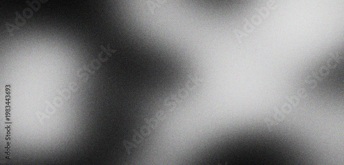 Konstfotografi Monochrome grainy gradient background with soft blurred light shapes, dark moody atmospheric texture for cinematic overlays, abstract black and white film grain aesthetic for modern designs