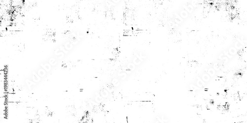 Minimalist grunge background with black ink splatters, scattered specks, dots, grain and subtle scratch marks on a clean white surface, abstract edgy style.