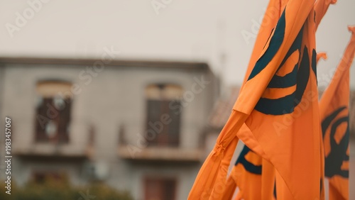 Flags of the Indian Vaisakhi religion fly in the square during the celebration