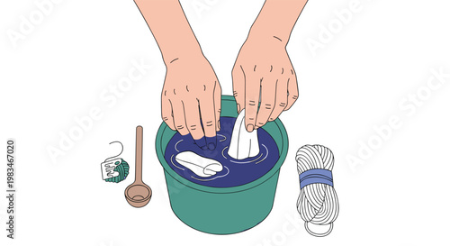 Hands submerge a piece of white cloth into a green bucket filled with deep blue liquid dye next to yarn and a wooden spoon on a clean white background.