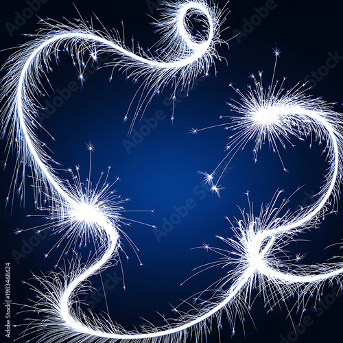 Sparkling white fireworks on a dark blue background creating a festive and celebratory atmosphere with glowing sparks and trails of light