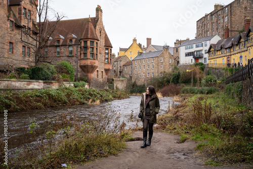 Woman contemplating the scenic views of Water of Leith in Edinburgh