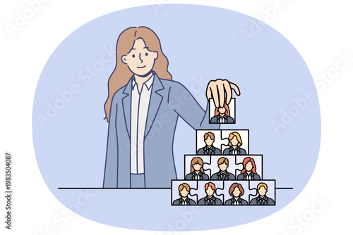 Woman recruiter is engaged in team building and creating corporate governance structure. Team building process from ceo of company, putting puzzles from employee portraits into pyramid