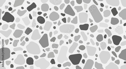 A mosaic of irregular shapes in varying shades of gray on a white background