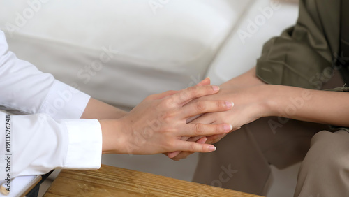 Tableau sur toile A person holding hands with another person in a supportive gesture