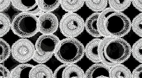 Pattern of textured, circular lace elements on a black background