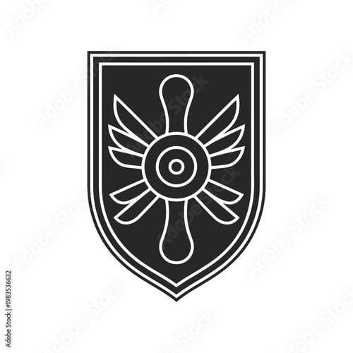 Black and white shield emblem featuring a stylized winged propeller design