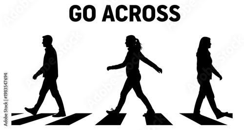 Silhouettes of people walking across a crosswalk during the day