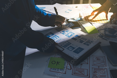 Team of Program Developer Collaborating on UXUI Design Planning in a Modern Office Environment