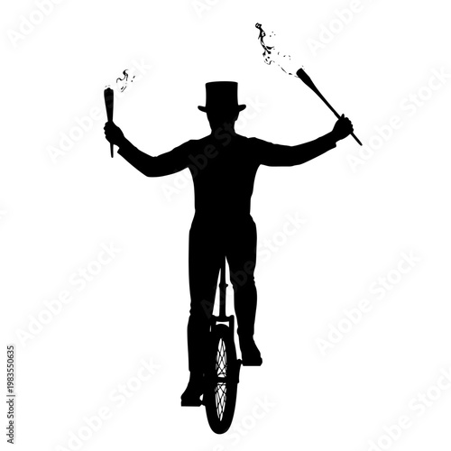 Silhouette of a performer balancing on a unicycle while holding flaming torches