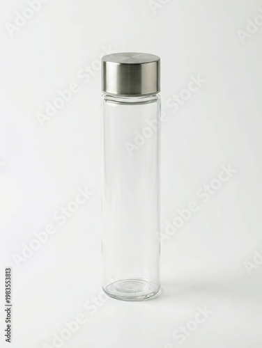 Close-up view of a cylindrical metallic connector with a coiled wire attachment.