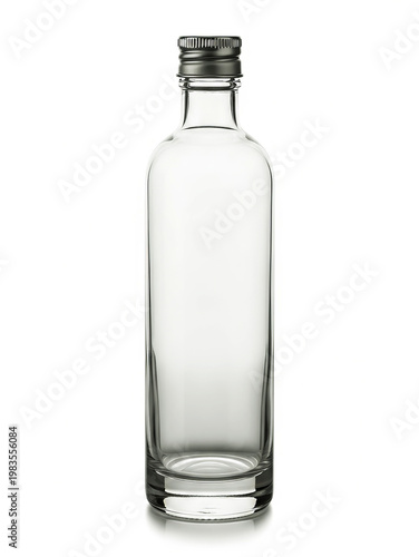 Empty clear glass bottle with black screw cap against white background