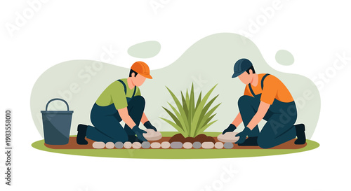 Two gardeners planting a small shrub in a garden bed.
