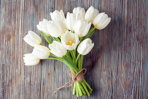 Fresh White Tulips Arranged in a Bouquet on a Wooden Table in Natural Light
