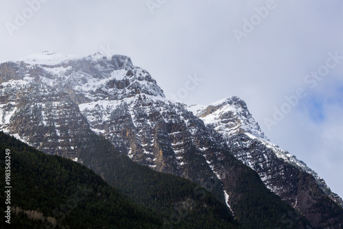 Snowcapped mountains dominating Pineta valley Pyrenees in Ordesa National Park