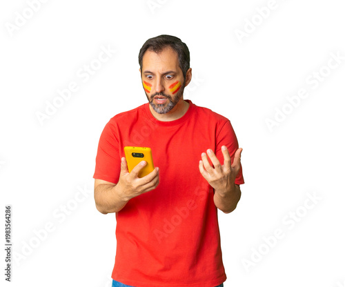 Spanish soccer fan reacting to phone on transparent background