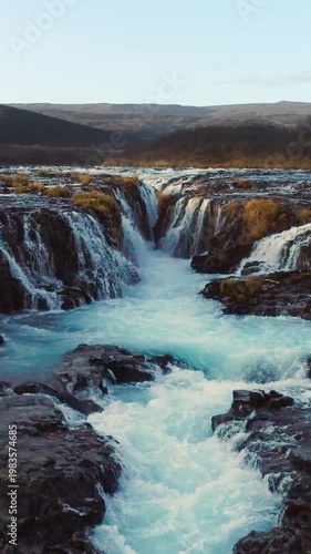 Epic Waterfall in scenic iceland nature, aerial shot - vertical video