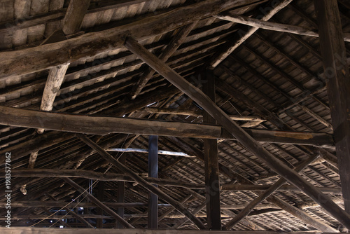 Historic wooden roof structure with beams inside traditional Porto wine cellar, Portugal, Porto, 17.10.2025