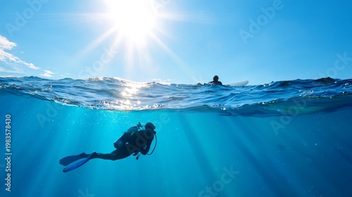 Scuba Diver Explores Underwater World While Surfer Waits Above the Water in B...