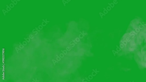 Realistic white smoke plume billowing and drifting on a green screen background