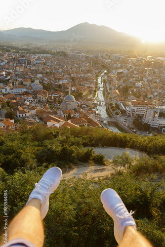 Stretching legs in front of old and cultural city of Prizren, Kosovo in the evening sunshine