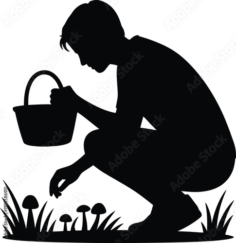 Silhouette of person with basket crouching to pick mushrooms in grass