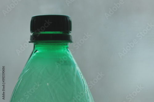 A close-up view of a bottle of soda