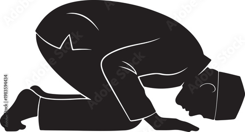 Silhouette of a muslim man in a prostration position during prayer wearing a traditional kufi cap and islamic robe