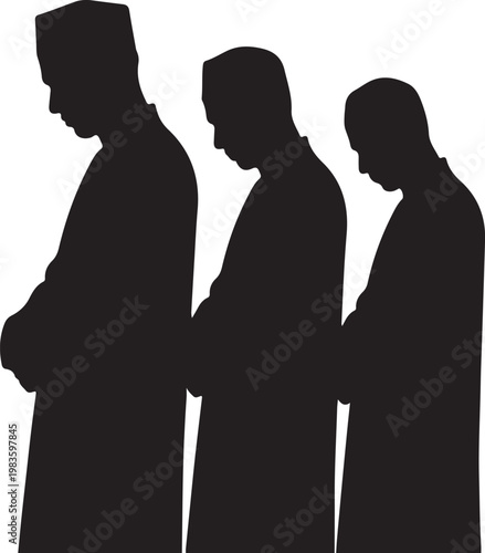 Silhouette of three muslim men standing in a row performing ritual prayer wearing traditional islamic clothing and caps