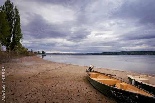 Low water shoreline with boats at Niederzell Reichenau on Lake Constance, Baden-Württemberg, Germany