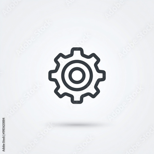 A simple gear icon with a dark outline and a light gray shadow