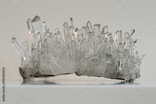 Transparent quartz crystal cluster isolated on white background, macro
