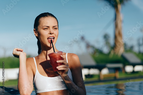Bilde på lerret Poolside woman outdoors, hydration and summer lifestyle, drinking a refreshing b