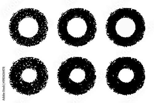 Six black roughly circular shapes arranged in two rows of three
