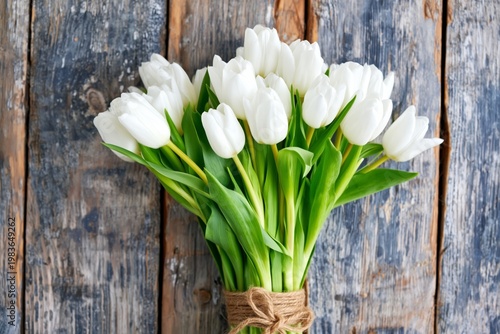 White Tulip Bouquet on Wooden Surface With Natural Light in Bright Setting
