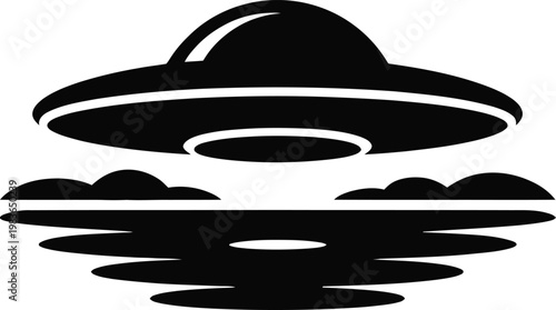 Black silhouette of a flying saucer hovering over water and clouds alien spaceship