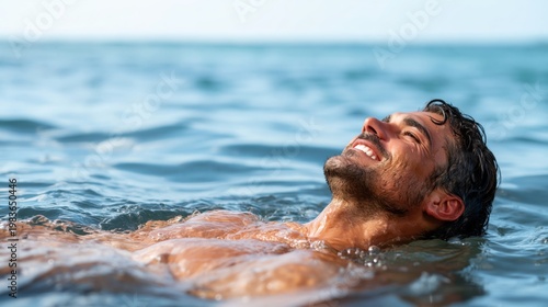 Woman Enjoys Sunny Day While Swimming in Clear Ocean Water