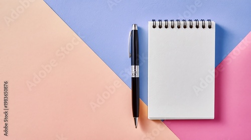 Notepad and Pen Placed on a Colorful Desk in a Creative Workspace Setting Dur...