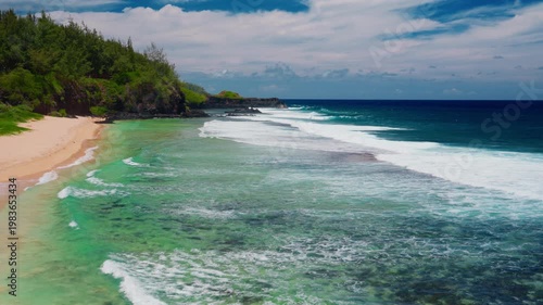 Huge waves crash against the rocky coastline on the tropical island of Mauritius