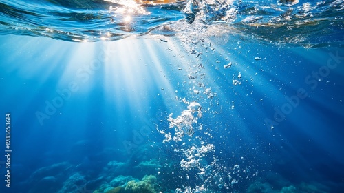 Light Shines Through Water as Bubbles Rise From the Ocean Floor in a Tropical...