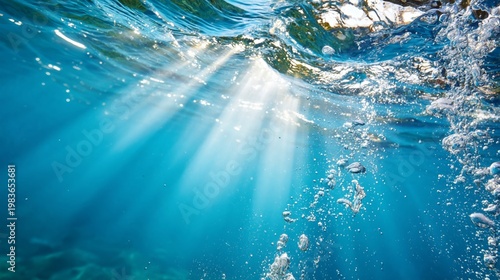 Sunlight Beams Shining Through Water Creating Ripples and Bubbles During a Su...