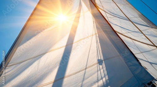 Sail Catches Sunlight as a Boat Navigates the Open Water During a Bright Day